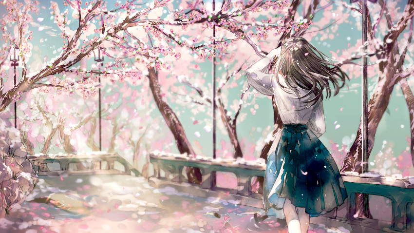 1girl ahma blue_skirt blue_sky brown_hair cherry_blossoms commentary_request day facing_away from_behind hand_up highres lamppost long_hair long_sleeves original outdoors pleated_skirt railing shirt skirt sky solo standing tree white_shirt