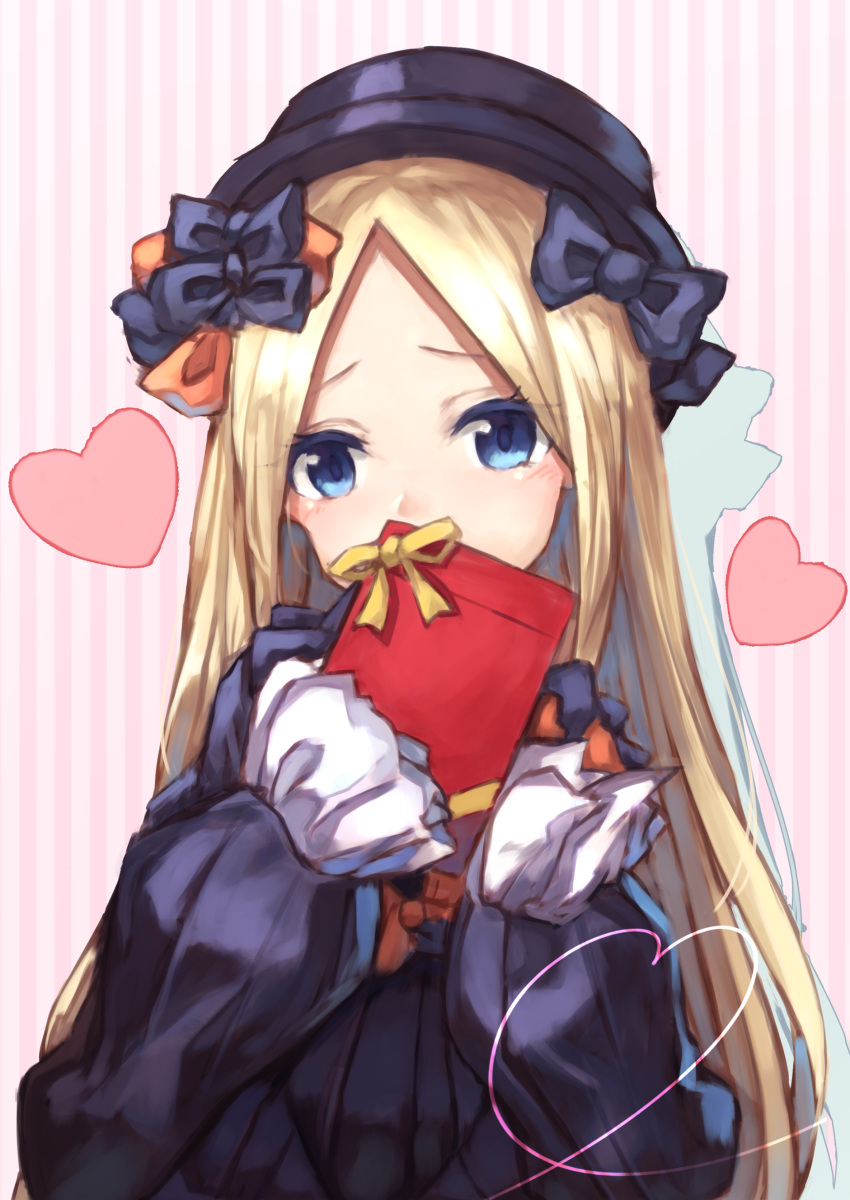 1girl abigail_williams_(fate/grand_order) absurdres bangs black_bow black_dress black_hat blonde_hair blue_eyes bow commentary_request covered_mouth dress fate/grand_order fate_(series) gift hair_bow hat head_tilt heart highres holding holding_gift long_hair long_sleeves looking_at_viewer orange_bow parted_bangs sleeves_past_fingers sleeves_past_wrists solo striped valentine vertical-striped_background vertical_stripes very_long_hair yuuki_nao_(pixiv10696483)