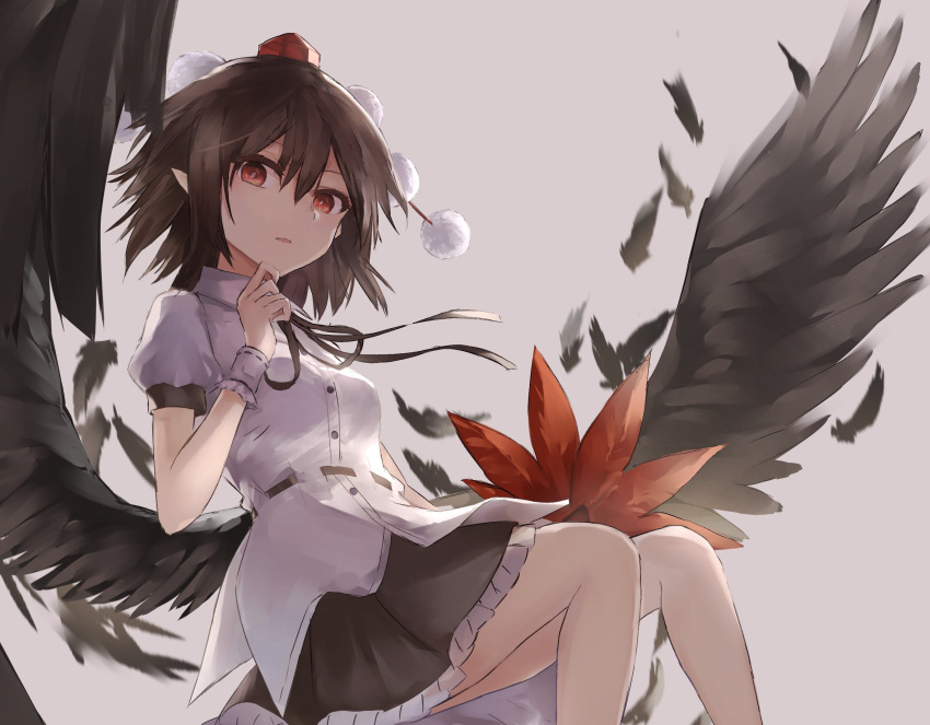 1girl black_skirt black_wings breasts brown_hair fan feathered_wings feathers finger_to_chin grey_background hair_between_eyes hat highres holding holding_fan leaf_fan looking_at_viewer medium_breasts parted_lips petticoat pointy_ears pom_pom_(clothes) puffy_short_sleeves puffy_sleeves shameimaru_aya shirt short_hair short_sleeves simple_background sitting skirt solo tassel thkani tokin_hat touhou white_shirt wings wrist_cuffs