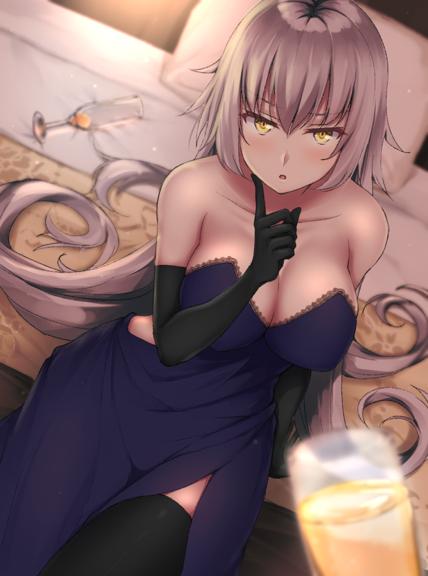 1girl :o alcohol arm_support bangs bare_shoulders bed black_gloves black_legwear blurry blush breasts champagne champagne_flute cleavage collarbone commentary_request cup depth_of_field dress drinking_glass elbow_gloves eyebrows_visible_through_hair fate/grand_order fate_(series) finger_to_cheek from_above gloves hair_between_eyes hand_up highres indoors jeanne_d'arc_(alter)_(fate) jeanne_d'arc_(fate)_(all) large_breasts long_hair looking_at_viewer looking_up navy_blue_dress on_bed pillow pov primamiya shiny shiny_hair sidelocks silver_hair sitting sitting_on_bed solo strapless strapless_dress thigh-highs tsurime v-shaped_eyebrows very_long_hair yellow_eyes