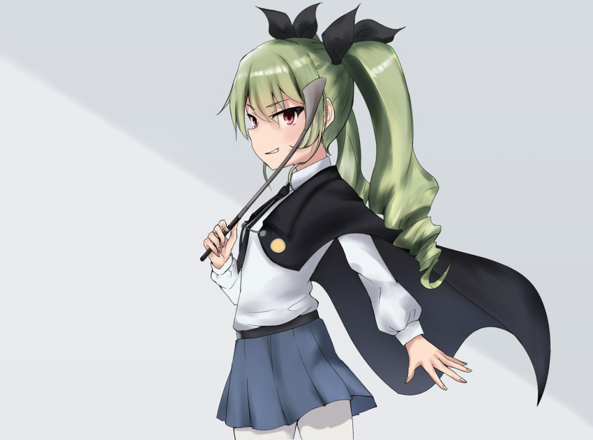 1girl anchovy anzio_school_uniform bangs belt black_belt black_cape black_neckwear black_ribbon black_skirt cape cowboy_shot dress_shirt drill_hair enogaki eyebrows_visible_through_hair from_side girls_und_panzer green_hair grey_background hair_ribbon highres holding long_hair long_sleeves looking_at_viewer miniskirt necktie pantyhose pleated_skirt red_eyes ribbon riding_crop school_uniform shirt skirt smirk solo standing twin_drills twintails two-tone_background white_legwear white_shirt