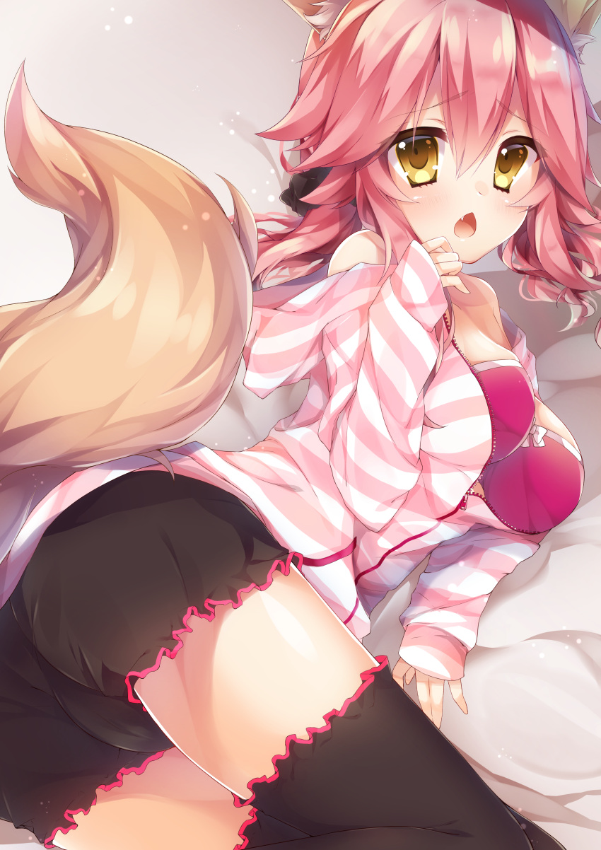 1girl absurdres animal_ears black_legwear blush bra breasts fang fate/grand_order fate_(series) fox_ears fox_tail highres kinosaki_yuuta large_breasts looking_at_viewer lying off_shoulder open_clothes open_mouth open_shirt pink_bra pink_hair shirt solo striped striped_shirt tail tamamo_(fate)_(all) tamamo_no_mae_(fate) thigh-highs underwear yellow_eyes
