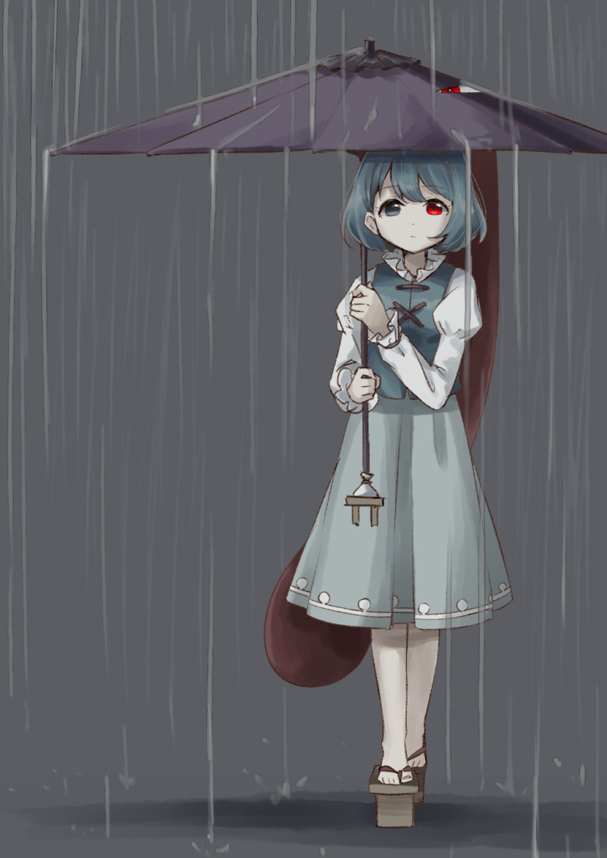 1girl bangs blue_eyes blue_hair blue_skirt blue_vest brown_footwear closed_mouth expressionless eyebrows_visible_through_hair full_body geta grey_background heterochromia highres holding holding_umbrella juliet_sleeves karakasa_obake ksk_(semicha_keisuke) long_skirt long_sleeves looking_at_viewer pale_skin puffy_sleeves purple_umbrella rain red_eyes short_hair skirt solo standing tareme tatara_kogasa tengu-geta tongue touhou two-handed umbrella vest water youkai