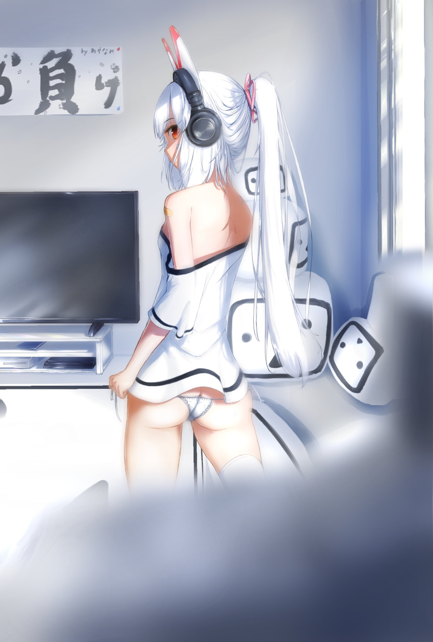 1girl ass ayanami_(azur_lane) azur_lane bandaid_on_arm bangs bare_shoulders bergreisfeld blurry blurry_foreground breasts butt_crack closed_mouth commentary_request depth_of_field eyebrows_visible_through_hair flat_screen_tv from_behind hair_between_eyes hair_ribbon headgear headphones high_ponytail highres indoors long_hair looking_at_viewer looking_back lowleg lowleg_panties no_pants off-shoulder_shirt panties pink_ribbon ponytail profile ribbon shirt side-tie_panties sidelocks silver_hair small_breasts solo television thigh-highs underwear very_long_hair white_legwear white_panties white_shirt window