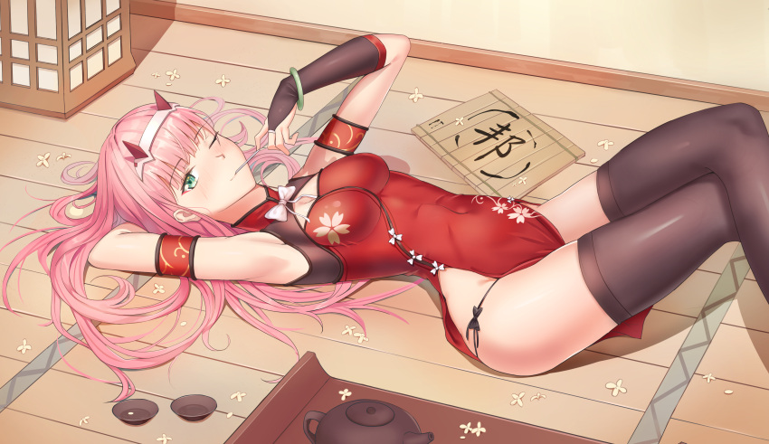 1girl absurdres armpits arms_behind_head bangs black_legwear bracelet breasts candy china_dress chinese_clothes cleavage cup darcy_(pixiv11949485) darling_in_the_franxx dress eyebrows_visible_through_hair floral_print food hairband highres horns jewelry legs_crossed lollipop long_hair lying on_back one_eye_closed panties pink_hair red_dress side-tie_panties solo teacup teapot thigh-highs underwear white_hairband zero_two_(darling_in_the_franxx)