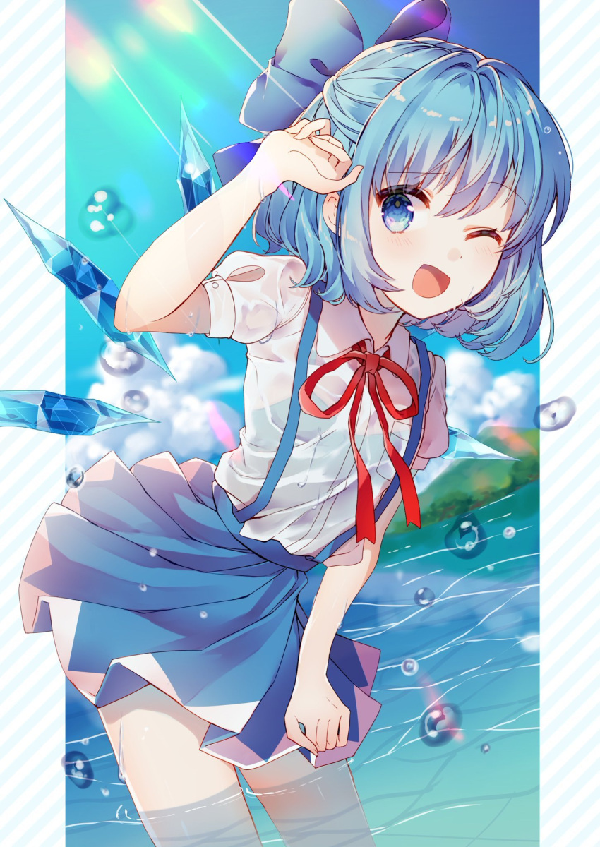 1girl bangs bare_arms blue_bow blue_eyes blue_hair blue_skirt bow cirno clouds collared_shirt commentary_request day dutch_angle eyebrows_visible_through_hair hair_bow hand_up highres ice ice_wings kawachi_rin leaning_forward looking_at_viewer miniskirt mountain neck_ribbon one_eye_closed open_mouth outdoors pocket red_ribbon ribbon see-through shirt short_sleeves skirt smile solo summer sunlight suspender_skirt suspenders touhou wading water water_drop wet wet_clothes white_shirt wing_collar wings