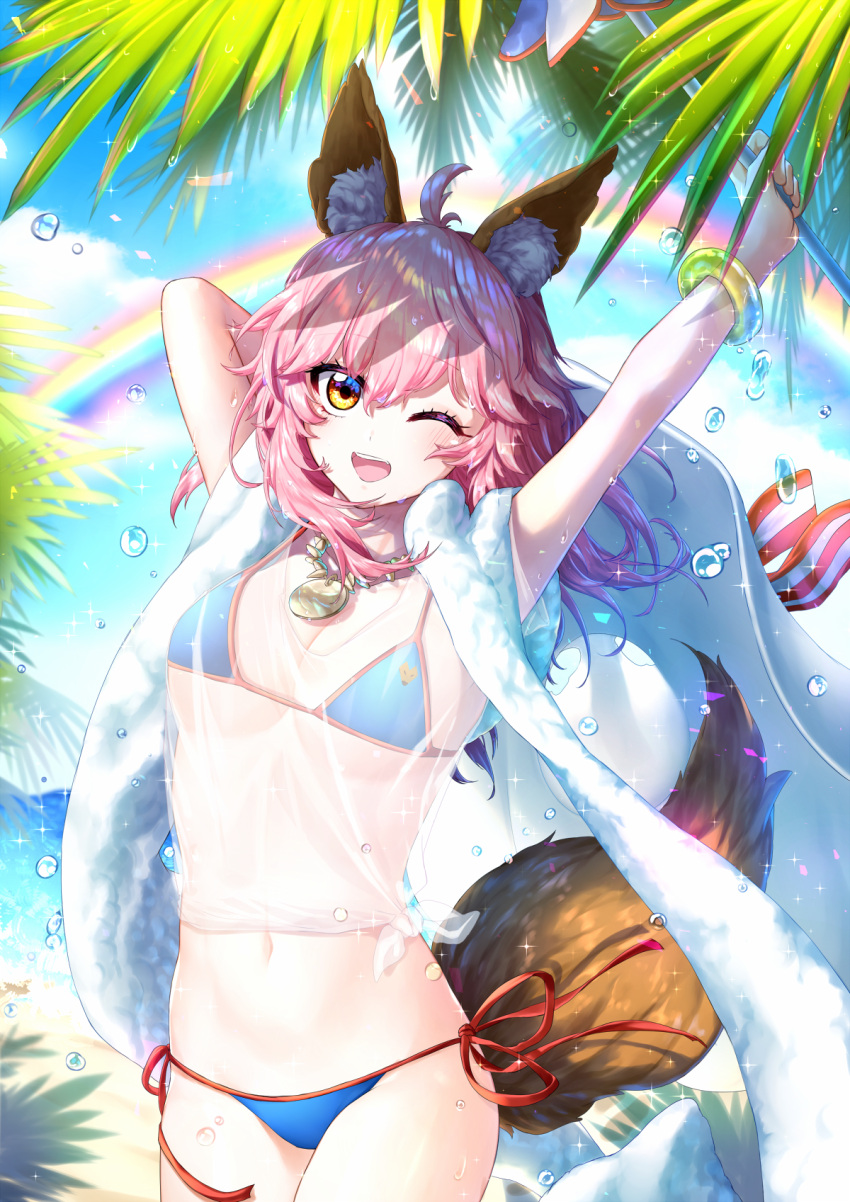 1girl ;d ahoge arms_up bangle bangs beach_towel bikini blue_bikini blue_sky blush bracelet breasts brown_eyes cleavage collarbone cowboy_shot day eyebrows_visible_through_hair fate/grand_order fate_(series) food fox_tail highres hm_(wonhml) holding jewelry large_breasts long_hair navel necklace one_eye_closed open_mouth outdoors palm_tree pendant pink_hair rainbow red_ribbon ribbon see-through shirt short_sleeves side-tie_bikini sky smile solo sparkle standing stomach strap_gap string_bikini swimsuit tail tamamo_(fate)_(all) tamamo_no_mae_(swimsuit_lancer)_(fate) tied_shirt towel towel_around_neck tree water_drop