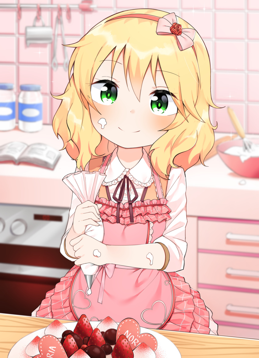 1girl absurdres apron bangs black_ribbon blonde_hair blurry blurry_background blush book cake closed_mouth depth_of_field eyebrows_visible_through_hair food food_on_face frilled_apron frilled_shirt_collar frills fruit green_eyes hair_between_eyes heart highres holding idolmaster idolmaster_cinderella_girls indoors long_hair long_sleeves mixing_bowl neck_ribbon noria open_book pastry_bag pink_apron ribbon sakurai_momoka shirt smile solo strawberry whisk white_shirt