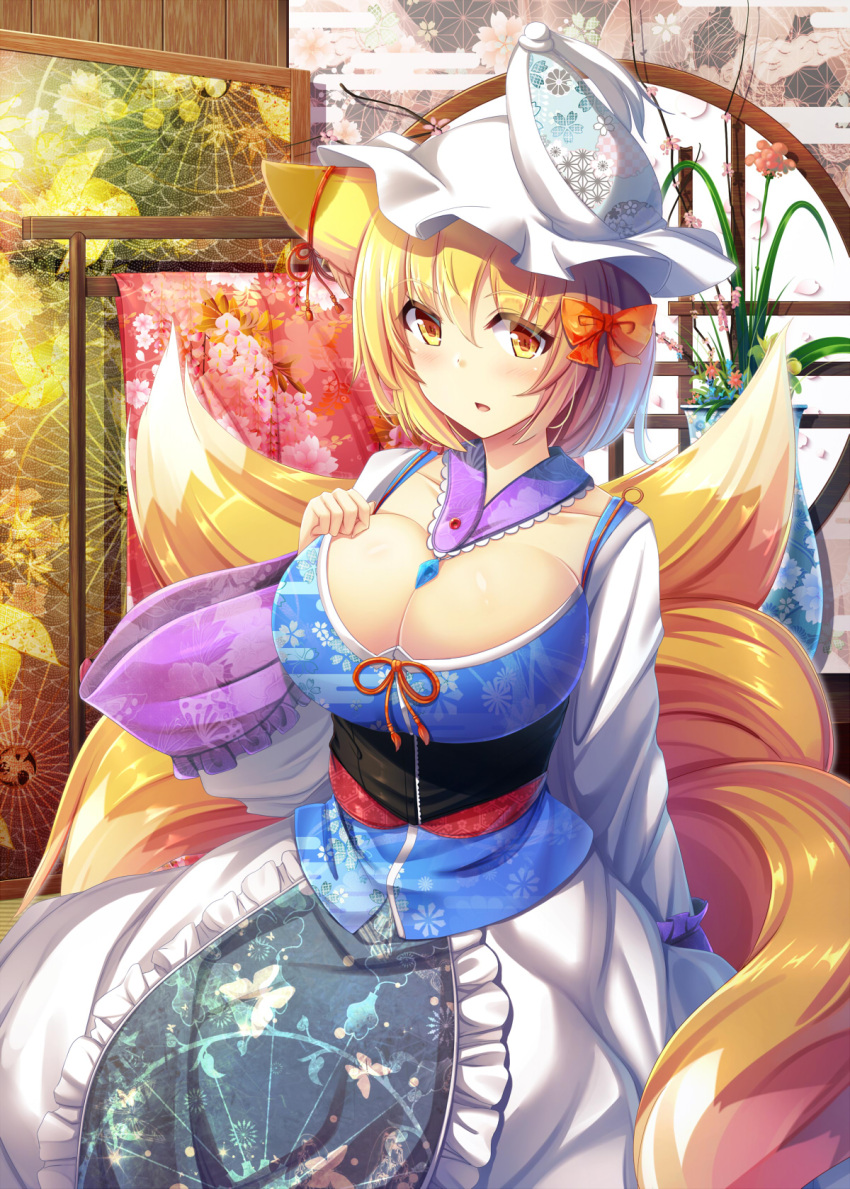 1girl animal_ears blonde_hair blush breasts cleavage commentary_request fox_ears fox_tail hair_between_eyes hat highres large_breasts liya long_sleeves looking_at_viewer multiple_tails pillow_hat short_hair solo tail touhou wide_sleeves yakumo_ran yellow_eyes