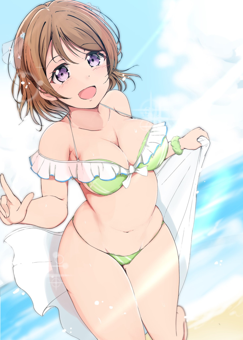 1girl :d \m/ ankoiri barefoot beach bikini breasts brown_hair cleavage clouds collarbone commentary_request day frilled_bikini frills front-tie_bikini front-tie_top green_bikini green_scrunchie groin hair_ornament halterneck highres holding holding_towel koizumi_hanayo looking_at_viewer love_live! love_live!_school_idol_project medium_breasts midriff navel ocean open_mouth outdoors scrunchie smile solo sparkle swimsuit towel violet_eyes white_towel wrist_scrunchie