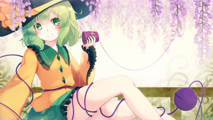 1girl beige_background black_hat blush bow commentary_request cup eyebrows_visible_through_hair feet_out_of_frame floral_print flower frilled_shirt_collar frills gengetsu_chihiro green_eyes green_hair green_skirt hat hat_bow head_tilt highres holding holding_cup komeiji_koishi long_sleeves looking_at_viewer miniskirt purple_flower shirt sitting skirt smile solo string third_eye touhou wide_sleeves yellow_bow yellow_shirt
