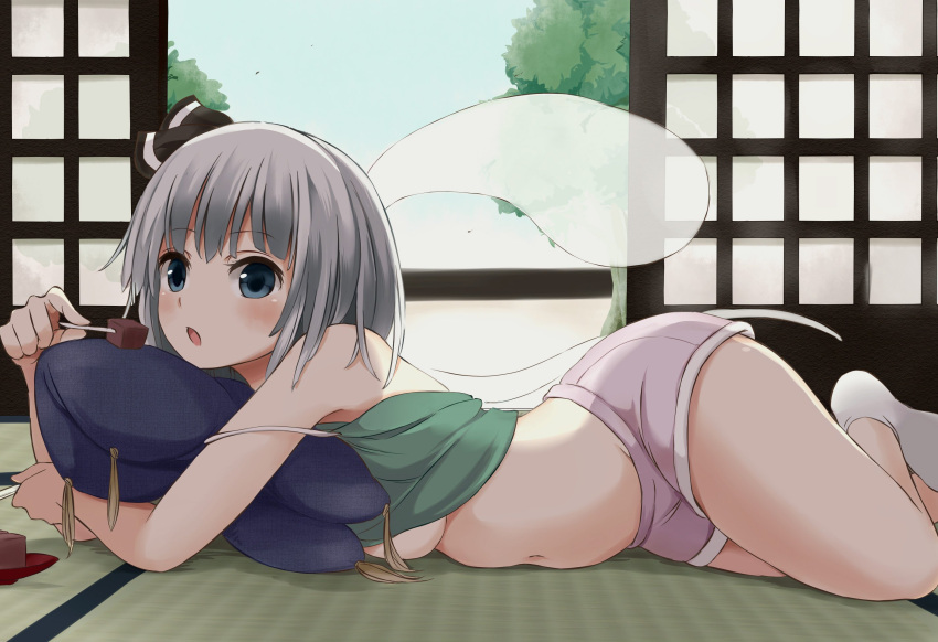 1girl alternate_costume bare_legs bare_shoulders blue_eyes blush breasts commentary_request day eating hair_ribbon highres indoors konpaku_youmu konpaku_youmu_(ghost) looking_at_viewer lying medium_breasts navel no_bra on_pillow on_side on_stomach open_mouth ribbon short_hair short_shorts shorts silver_hair solo spaghetti_strap stomach strap_slip tank_top tank_top_lift tatami techi_(techi35499) touhou under_boob