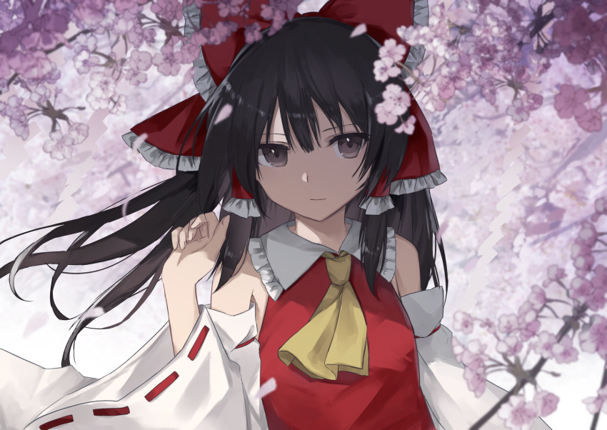 1girl ascot bare_shoulders black_hair bow brown_eyes cherry_blossoms detached_sleeves frilled_bow frilled_shirt_collar frills hair_bow hair_tubes hakurei_reimu hand_up highres light_smile long_hair long_sleeves looking_at_viewer petals red_bow sidelocks solo thkani touhou upper_body wide_sleeves yellow_neckwear