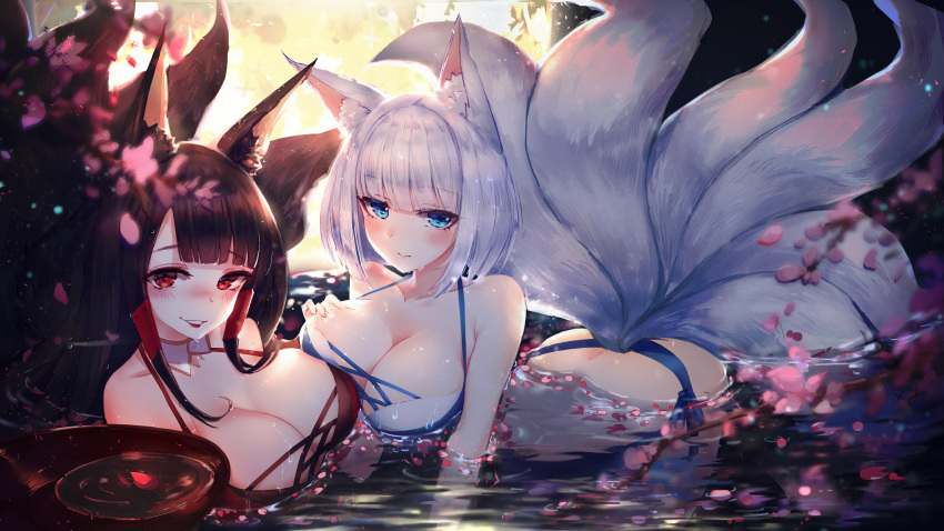 2girls absurdres akagi_(azur_lane) all_fours animal_ears ass azur_lane bangs bikini black_bikini blue_eyes blunt_bangs blurry_foreground blush breasts brown_hair cleavage cup day dimples_of_venus eyebrows_visible_through_hair fox_ears fox_tail hand_on_own_chest highres holding holding_cup in_water kaga_(azur_lane) large_breasts light_rays long_hair looking_at_viewer lying multiple_girls multiple_tails parted_lips petals petals_on_liquid red_eyes ripples short_hair sidelocks smile swimsuit tail water wet white_bikini white_hair xing