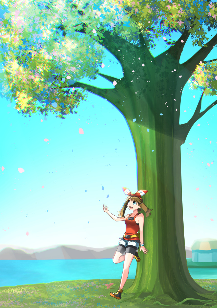 1girl :d absurdres bike_shorts black_footwear black_shorts brown_hair day happy haruka_(pokemon) highres long_hair nature open_mouth outdoors petals pokemon pokemon_(game) pokemon_oras red_shirt shirt shoes shorts smile solo standing tree water white_shorts yuihiko