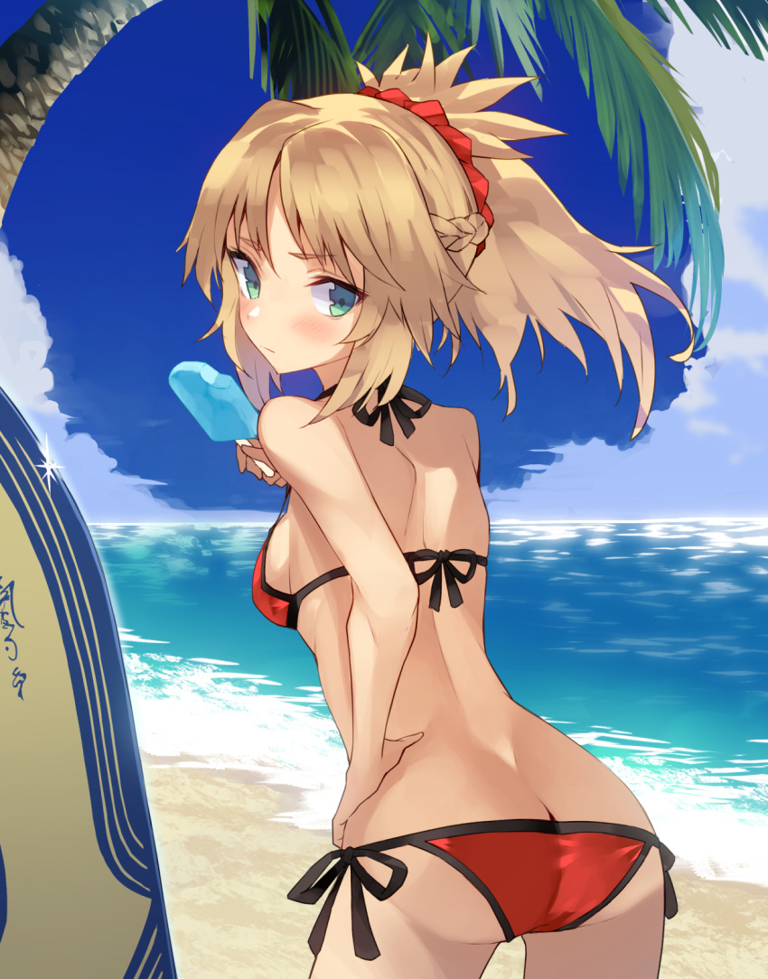 1girl ass bangs bare_arms bare_shoulders beach bikini blonde_hair blue_sky blush breasts butt_crack closed_mouth clouds commentary_request day eyebrows_visible_through_hair fate/grand_order fate_(series) food green_eyes hair_between_eyes halter_top halterneck hand_on_hip highres holding holding_food horizon leaning_forward long_hair looking_at_viewer looking_back medium_breasts mordred_(fate)_(all) mordred_(swimsuit_rider)_(fate) nuqura ocean outdoors palm_tree parted_bangs ponytail popsicle red_bikini sand side-tie_bikini sky solo surfboard swimsuit tree water