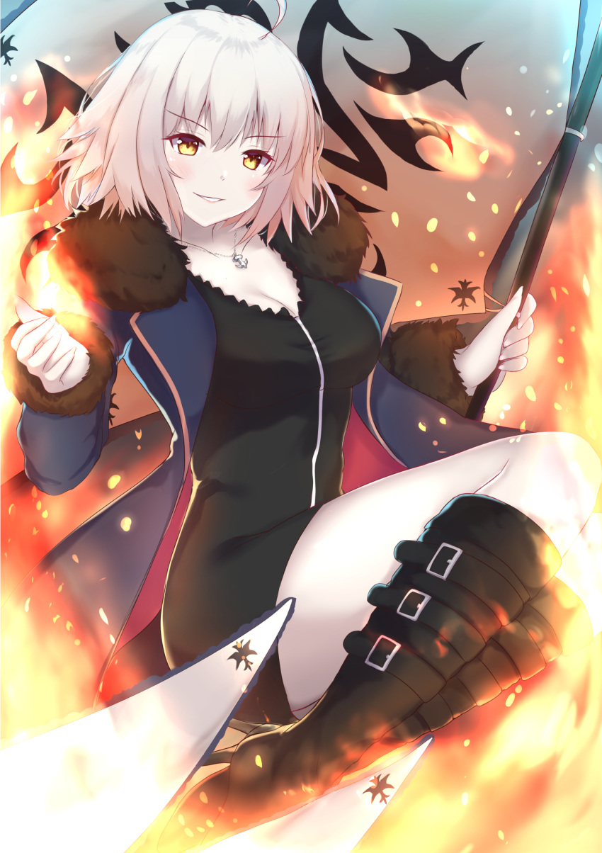 1girl ahoge banner black_dress black_footwear blue_cape boots breasts cape cleavage dress eyebrows_visible_through_hair fate/grand_order fate_(series) fire fur_trim high_heel_boots high_heels highres holding jeanne_d'arc_(alter)_(fate) jeanne_d'arc_(fate)_(all) jewelry john_zhang knee_boots looking_at_viewer medium_breasts necklace parted_lips short_dress short_hair silver_hair smile solo yellow_eyes