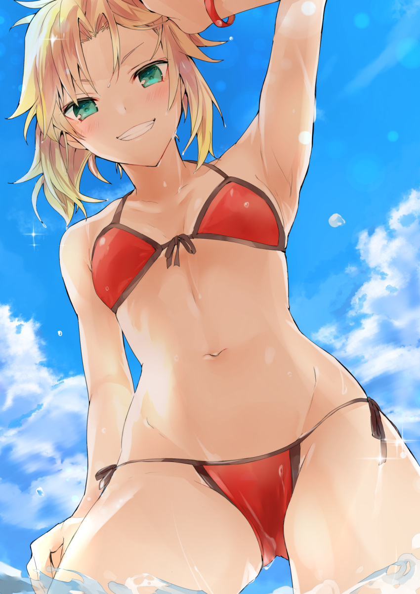1girl arm_up armpits bangs bare_arms bare_shoulders bikini blonde_hair blue_sky breasts clouds collarbone commentary_request day dutch_angle eyebrows_visible_through_hair fate/grand_order fate_(series) from_below front-tie_bikini front-tie_top green_eyes grin groin highres looking_at_viewer looking_down mordred_(fate)_(all) mordred_(swimsuit_rider)_(fate) navel outdoors red_bikini side-tie_bikini sky small_breasts smile solo swimsuit tan tomozero water wet wet_hair