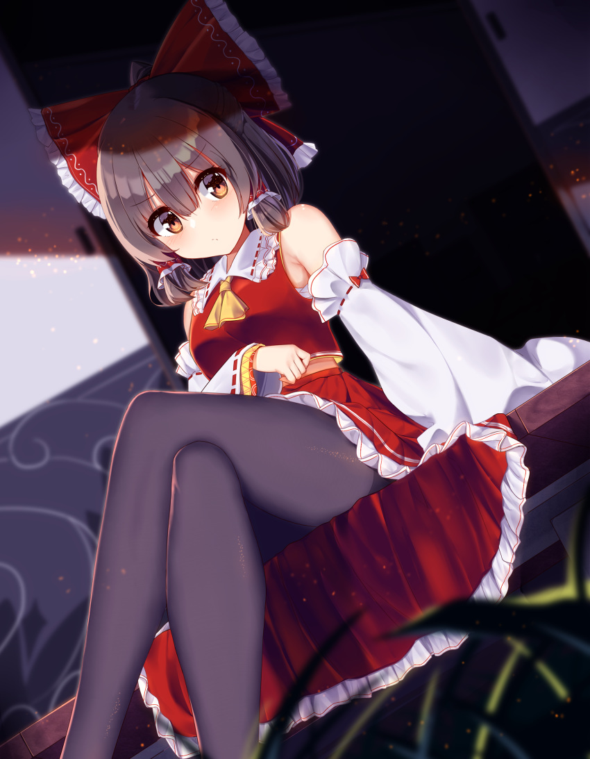 1girl ascot bangs bare_shoulders black_legwear blush bow brown_eyes brown_hair closed_mouth ddt_(darktrident) detached_sleeves dutch_angle eyebrows_visible_through_hair frilled_skirt frills hair_bow hair_tubes hakurei_reimu highres legs_crossed long_hair looking_at_viewer pantyhose red_bow red_skirt red_vest ribbon-trimmed_sleeves ribbon_trim sitting skirt skirt_set sliding_doors solo touhou vest wide_sleeves yellow_neckwear
