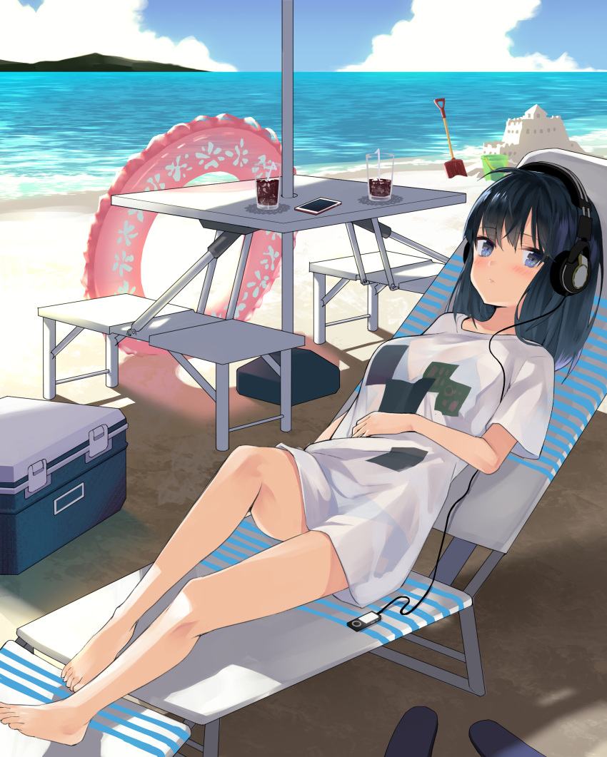 1girl absurdres bare_legs barefoot beach bendy_straw black_hair blue_eyes blue_sky breasts bucket cellphone chair clouds cloudy_sky commentary_request cooler cup day digital_media_player drink drinking_glass drinking_straw hand_on_own_stomach headphones highres horizon innertube long_hair looking_at_viewer lounge_chair medium_breasts mountain nuqura ocean original outdoors phone pink_innertube sand sand_castle sand_sculpture shadow shirt short_sleeves shovel sky smartphone solo table transparent water white_shirt
