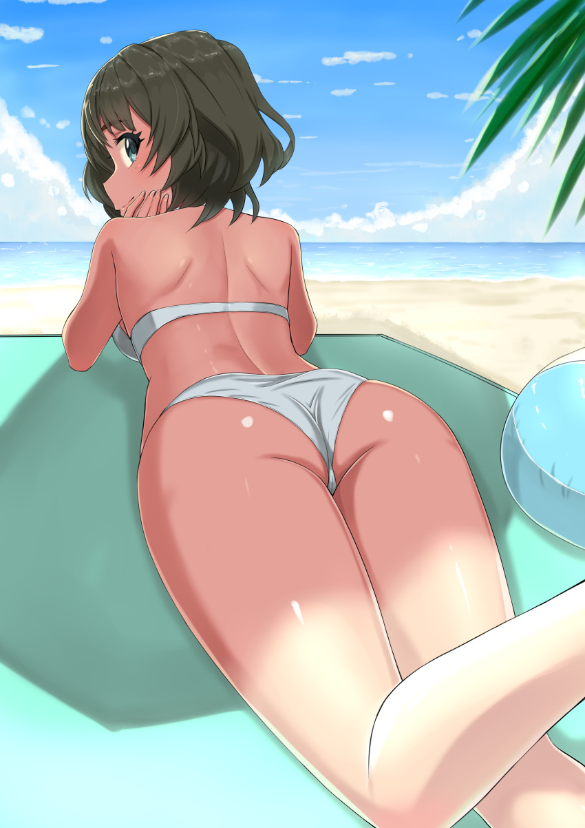 1girl absurdres ass back ball beach beachball bikini blue_sky brown_hair chin_rest closed_mouth clouds cloudy_sky commentary day eyebrows_visible_through_hair from_behind green_eyes highres idolmaster idolmaster_cinderella_girls idolmaster_cinderella_girls_starlight_stage k-ya. looking_at_viewer lying mole mole_under_eye ocean on_stomach outdoors short_hair shoulder_blades sky smile solo swimsuit takagaki_kaede thighs white_bikini