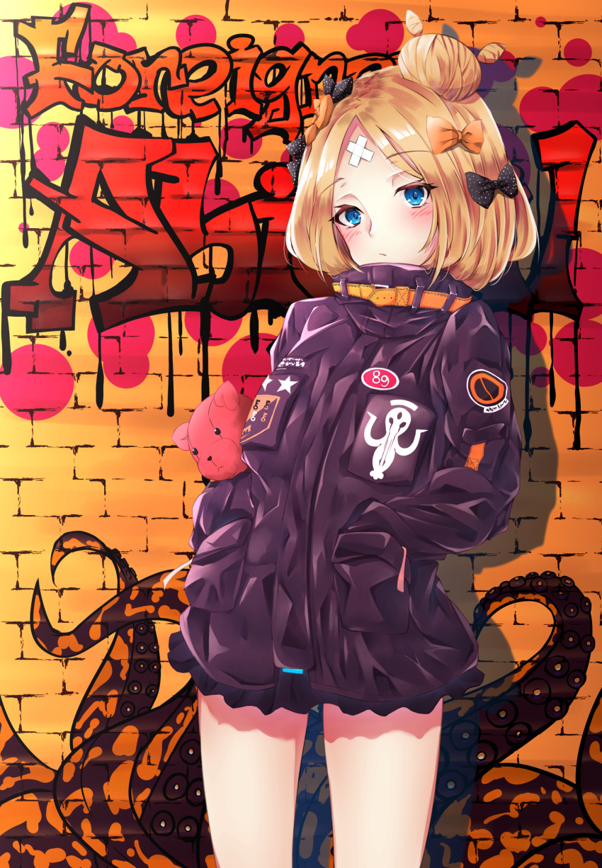 1girl abigail_williams_(fate/grand_order) bangs black_bow black_jacket blonde_hair blue_eyes blush bow brick_wall character_name closed_mouth commentary_request crossed_bandaids eyebrows_visible_through_hair fate/grand_order fate_(series) graffiti hair_bow hair_bun hands_in_pockets head_tilt highres jacket long_hair long_sleeves looking_at_viewer object_hug orange_bow parted_bangs polka_dot polka_dot_bow siroimo0828 sleeves_past_fingers sleeves_past_wrists solo standing stuffed_animal stuffed_toy suction_cups teddy_bear tentacle