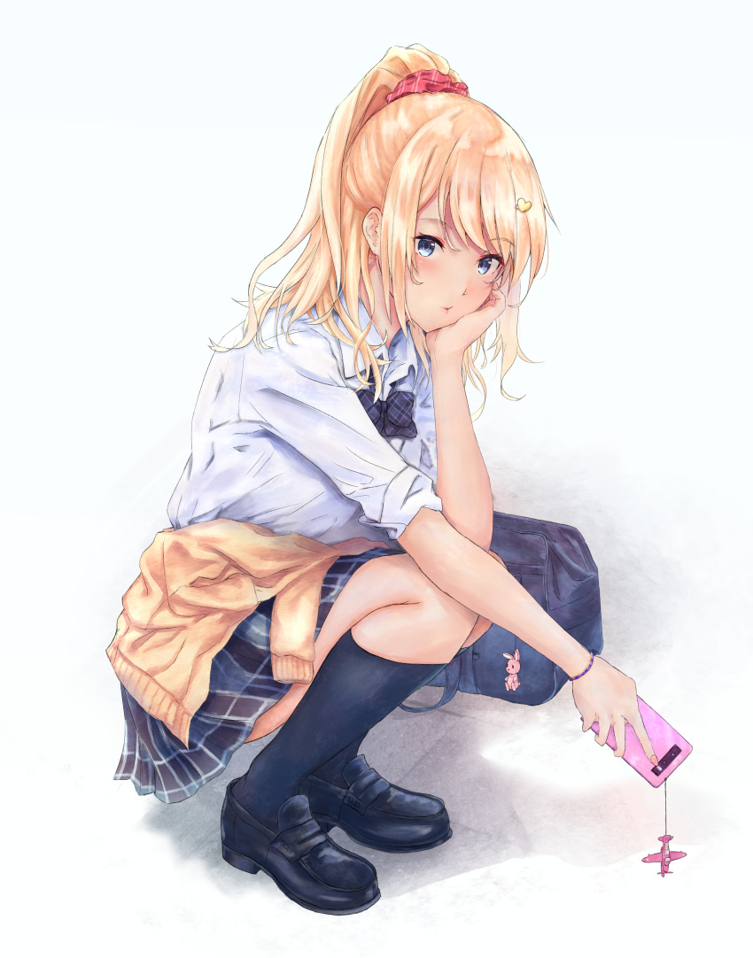 1girl :t absurdres astoria_(azur_lane) azur_lane bag blonde_hair blue_eyes bow bowtie cellphone cellphone_charm clothes_around_waist hair_ornament hand_on_own_face heart heart_hair_ornament highres kuroneru phone plaid plaid_skirt pleated_skirt ponytail school_bag school_uniform scrunchie shoes simple_background skirt sleeves_rolled_up socks solo squatting sweater_around_waist