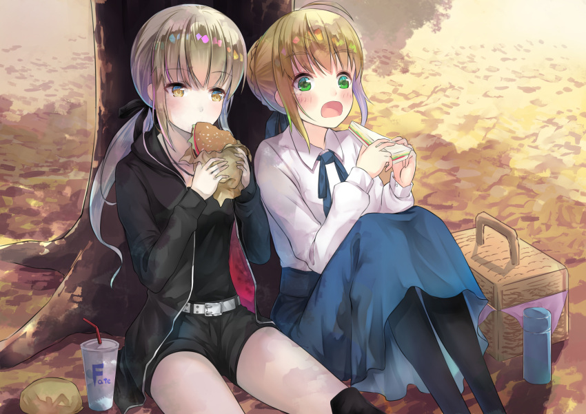 2girls against_tree ahoge artoria_pendragon_(all) basket black_jacket black_legwear black_ribbon black_shirt black_shorts blonde_hair blue_ribbon blue_skirt blush collarbone copyright_name day eyebrows_visible_through_hair fate/stay_night fate_(series) food green_eyes hair_ribbon hamburger highres holding holding_food hood hooded_jacket jacket jewelry long_skirt multiple_girls neck_ribbon necklace open_clothes open_jacket open_mouth outdoors ponytail ranmaruuuu00 ribbon saber saber_alter sandwich shirt short_hair short_shorts shorts sidelocks sitting skirt tree white_shirt yellow_eyes