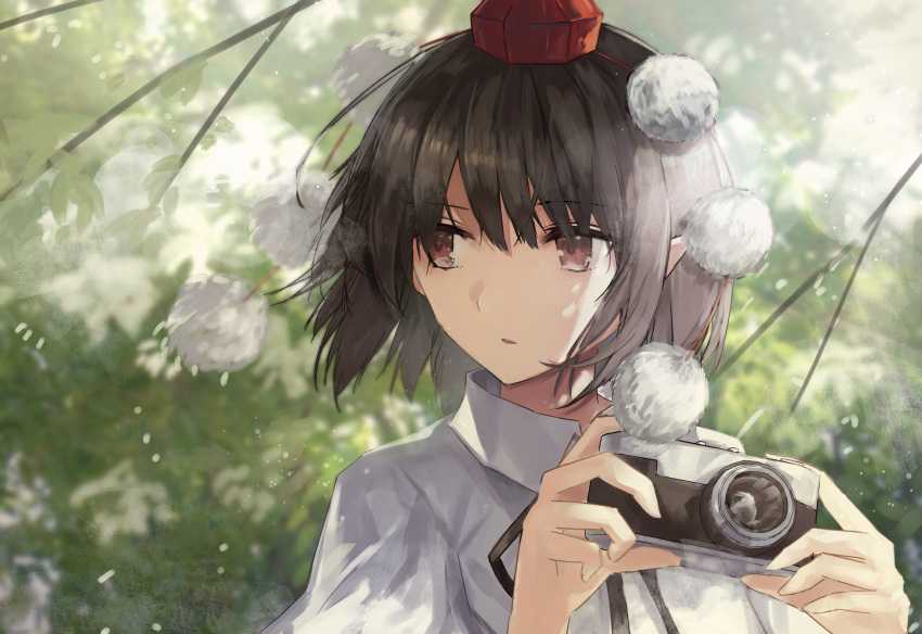 1girl bangs black_hair black_neckwear black_ribbon branch brown_eyes camera commentary eyebrows_visible_through_hair hat highres holding holding_camera leaf looking_to_the_side neck_ribbon parted_lips pointy_ears pom_pom_(clothes) puffy_short_sleeves puffy_sleeves ribbon shameimaru_aya shirt short_hair short_sleeves solo thkani tokin_hat touhou upper_body white_shirt wing_collar