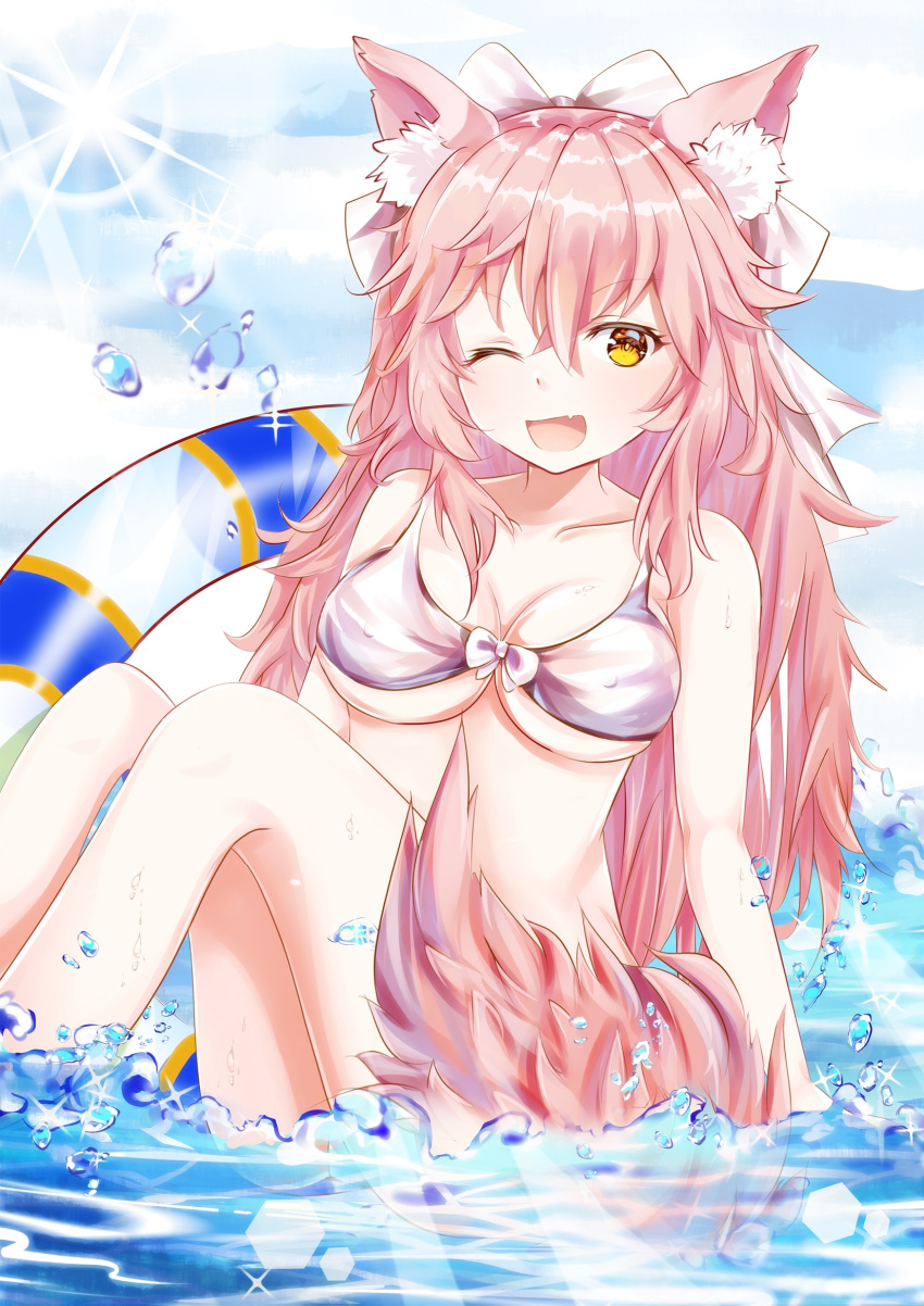 1girl ;d animal_ears bangs bikini blue_sky bow breasts brown_eyes cleavage clouds commentary_request day erect_nipples eyebrows_visible_through_hair fang fate/extra fate_(series) fox_ears fox_girl fox_tail hair_between_eyes hair_bow highres innertube long_hair looking_at_viewer medium_breasts mutang one_eye_closed open_mouth outdoors pink_hair sitting sky smile solo striped striped_innertube swimsuit tail tamamo_(fate)_(all) tamamo_no_mae_(fate) transparent very_long_hair water white_bikini white_bow
