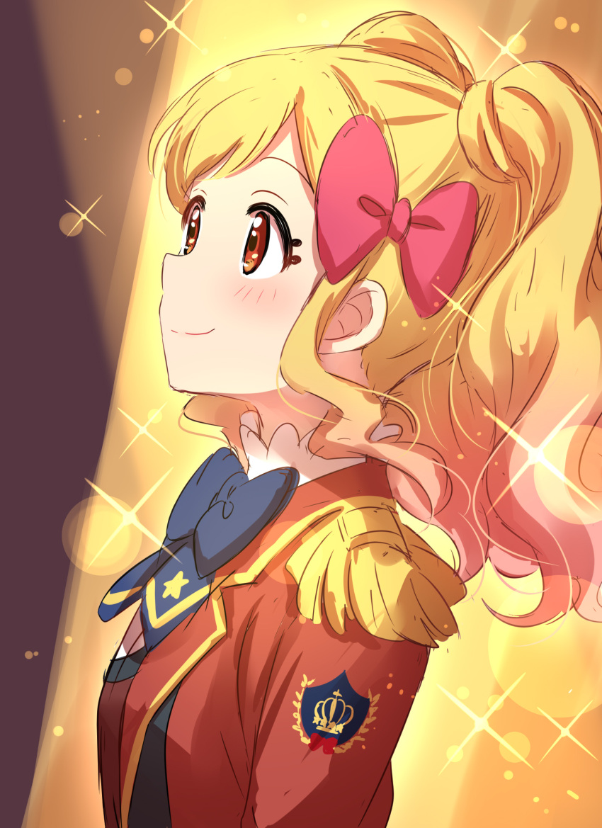 1girl aikatsu!_(series) aikatsu_stars! badge blonde_hair blue_neckwear blush bow bowtie brown_eyes closed_mouth epaulettes eyelashes from_side gradient_hair hair_bow highres jacket lens_flare long_sleeves looking_up multicolored_hair nijino_yume pink_bow pink_hair red_jacket s4_uniform sekina smile solo sparkle spotlight twintails upper_body