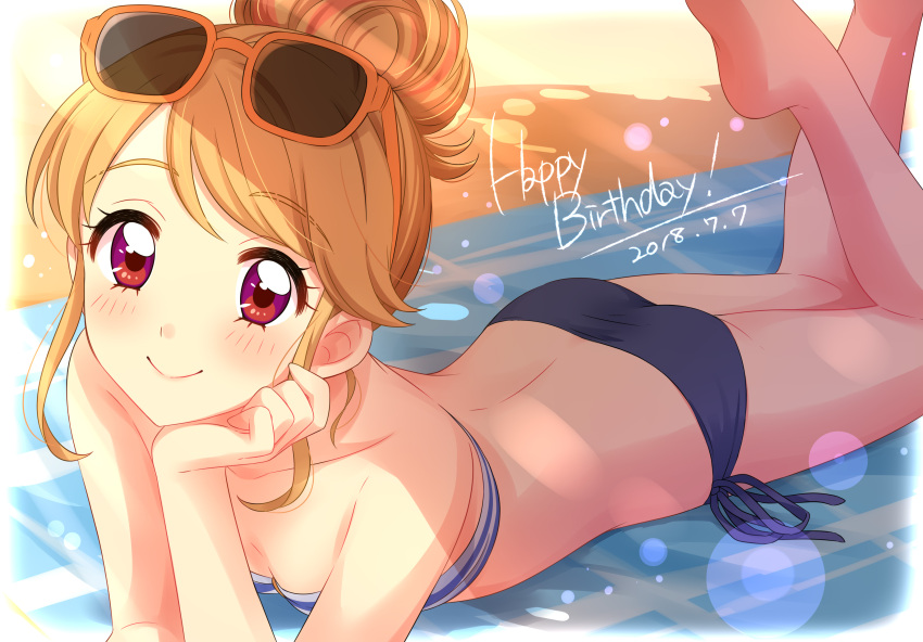 1girl absurdres aikatsu! aikatsu!_(series) ass bare_shoulders barefoot beach beach_towel bikini blue_bikini blush breasts chin_rest commentary_request dated day eyebrows_visible_through_hair eyewear_on_head hair_bun happy_birthday highres light_brown_hair light_rays looking_at_viewer lying natsuki_mikuru o-ring o-ring_top on_stomach outdoors red_eyes sand sekina side-tie_bikini small_breasts smile soles solo sunglasses swimsuit the_pose towel