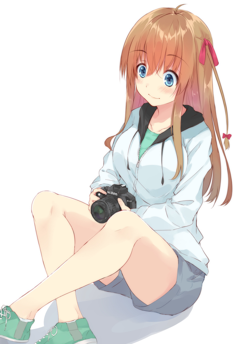 1girl absurdres ahoge bangs blue_eyes blush bow breasts brown_hair camera collarbone commentary_request eyebrows_visible_through_hair hair_between_eyes hair_bow hair_ribbon highres holding holding_camera hood hoodie knees_up large_breasts legs_crossed long_hair long_sleeves looking_at_viewer nakadadaichi nikon_(company) original product_placement ribbon shadow shoes shorts sidelocks simple_background sitting smile sneakers solo white_background zipper