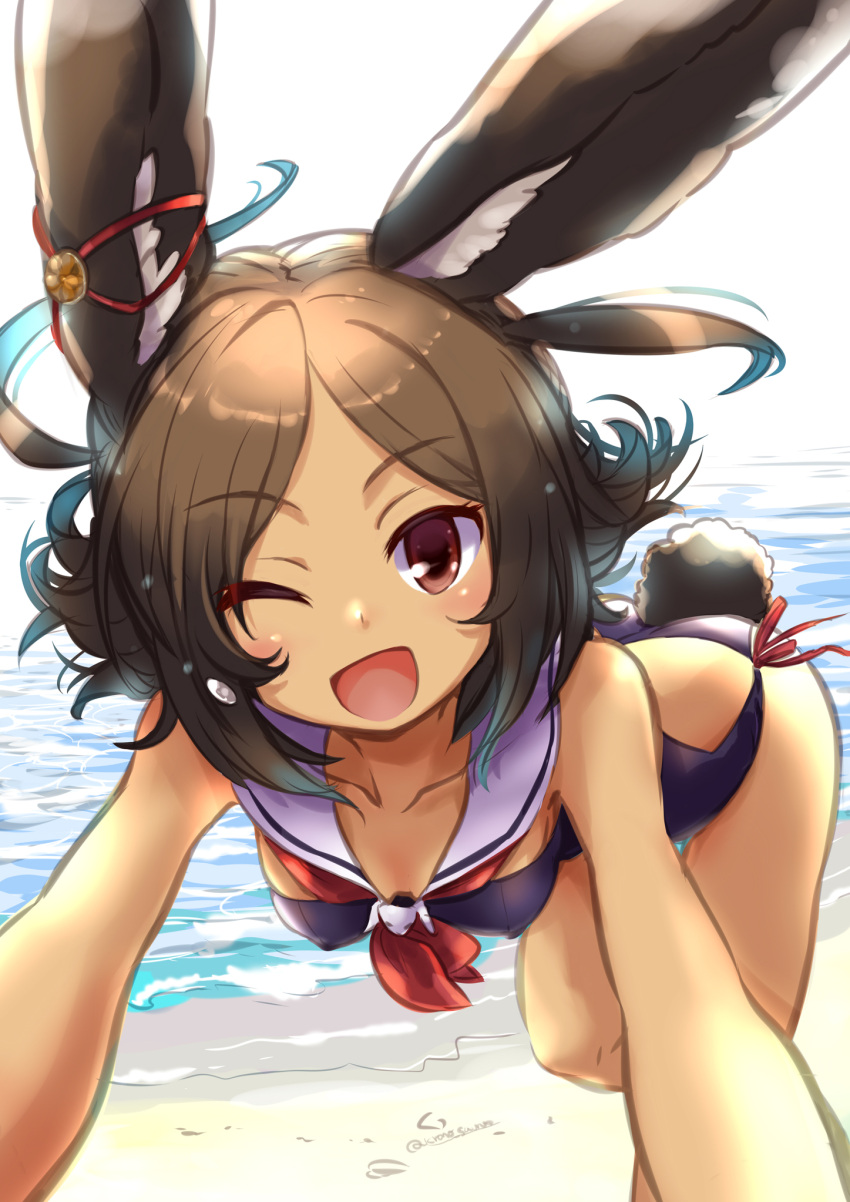 1girl ;d animal_ears azur_lane bending_forward black_hair breasts brown_eyes bunny_girl bunny_tail collarbone commentary_request dark_skin hair_ornament hairclip highres i-26_(azur_lane) kurono_tokage looking_at_viewer ocean one_eye_closed open_mouth rabbit_ears sand sky small_breasts smile solo swimsuit tail tan twitter_username