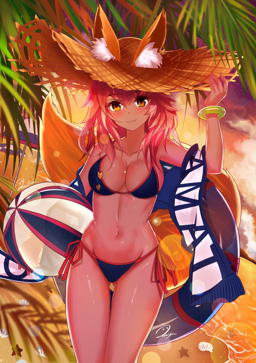 1girl :3 animal_ear_fluff animal_ears balloon bikini blue_bikini blush breasts collarbone ears_through_headwear fang fate/grand_order fate_(series) fox_ears fox_girl fox_tail groin hat highres innertube large_breasts long_hair looking_at_viewer navel ocean outdoors palm_leaf palm_tree palms pink_hair side-tie_bikini solo straw_hat swimsuit tail tamamo_(fate)_(all) tamamo_no_mae_(swimsuit_lancer)_(fate) tree twilight yellow_eyes