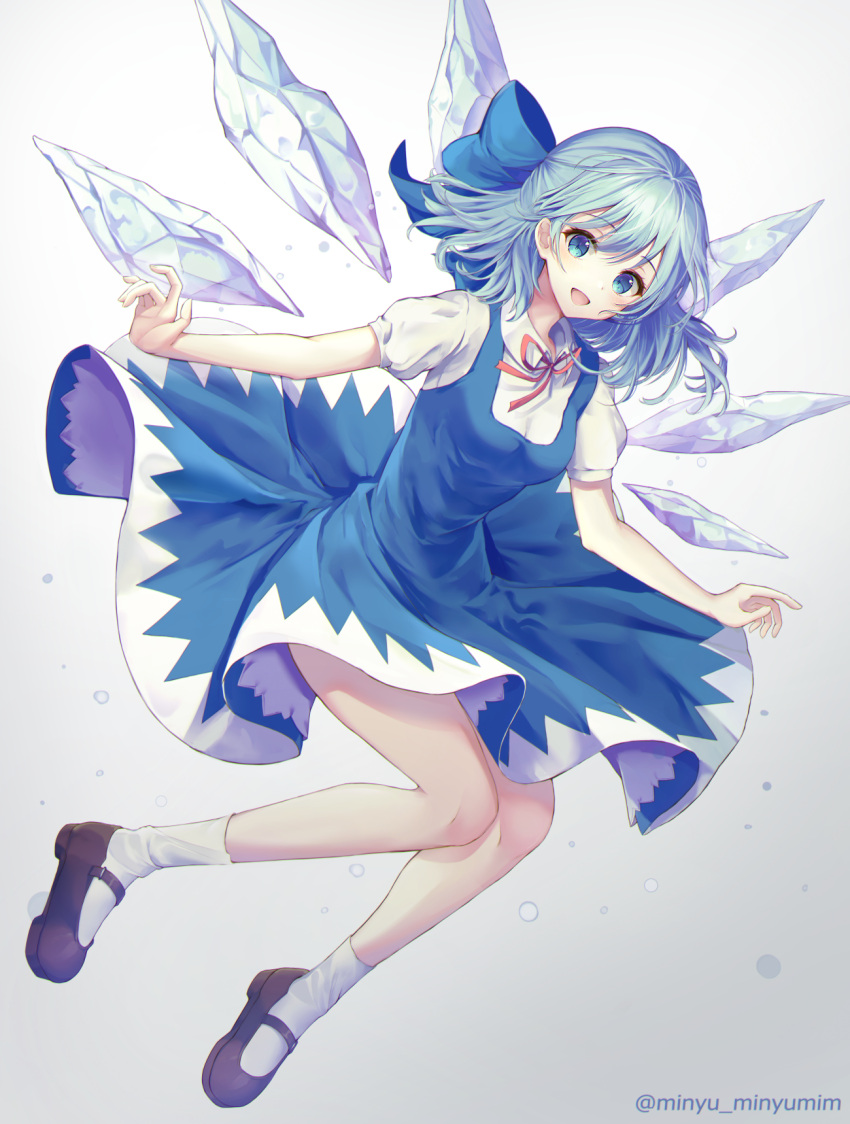 1girl :d blue_bow blue_dress blue_eyes blue_hair bow cirno commentary_request dress eyebrows_visible_through_hair full_body grey_background hair_bow highres ice ice_wings legs looking_at_viewer minyumim open_mouth red_ribbon ribbon short_hair short_sleeves smile socks solo touhou twitter_username wings