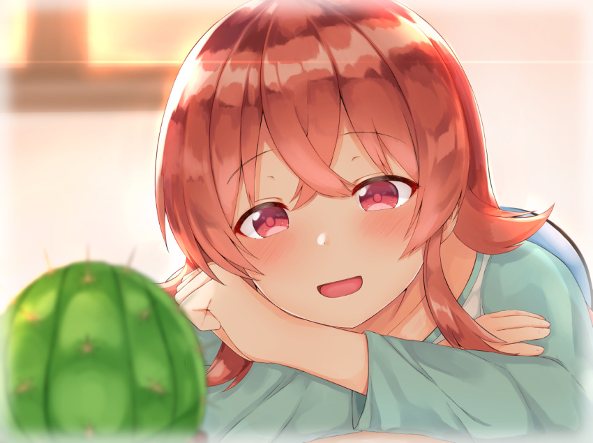 1girl :d bangs blurry blurry_background blurry_foreground blush brown_hair cactus collarbone depth_of_field eyebrows_visible_through_hair fingernails green_shirt hair_between_eyes head_tilt idolmaster idolmaster_shiny_colors komiya_kaho long_sleeves noa_(letizia) open_mouth red_eyes shirt sidelocks smile solo