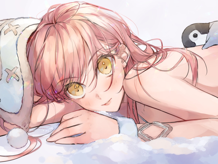 1girl ashita_kura bangs bare_shoulders beanie bird blush commentary_request eyebrows_visible_through_hair fate/grand_order fate_(series) hat highres lips long_hair looking_at_viewer lying medb_(fate)_(all) medb_(swimsuit_saber)_(fate) on_stomach parted_lips penguin pink_hair smile solo swimsuit upper_body yellow_eyes