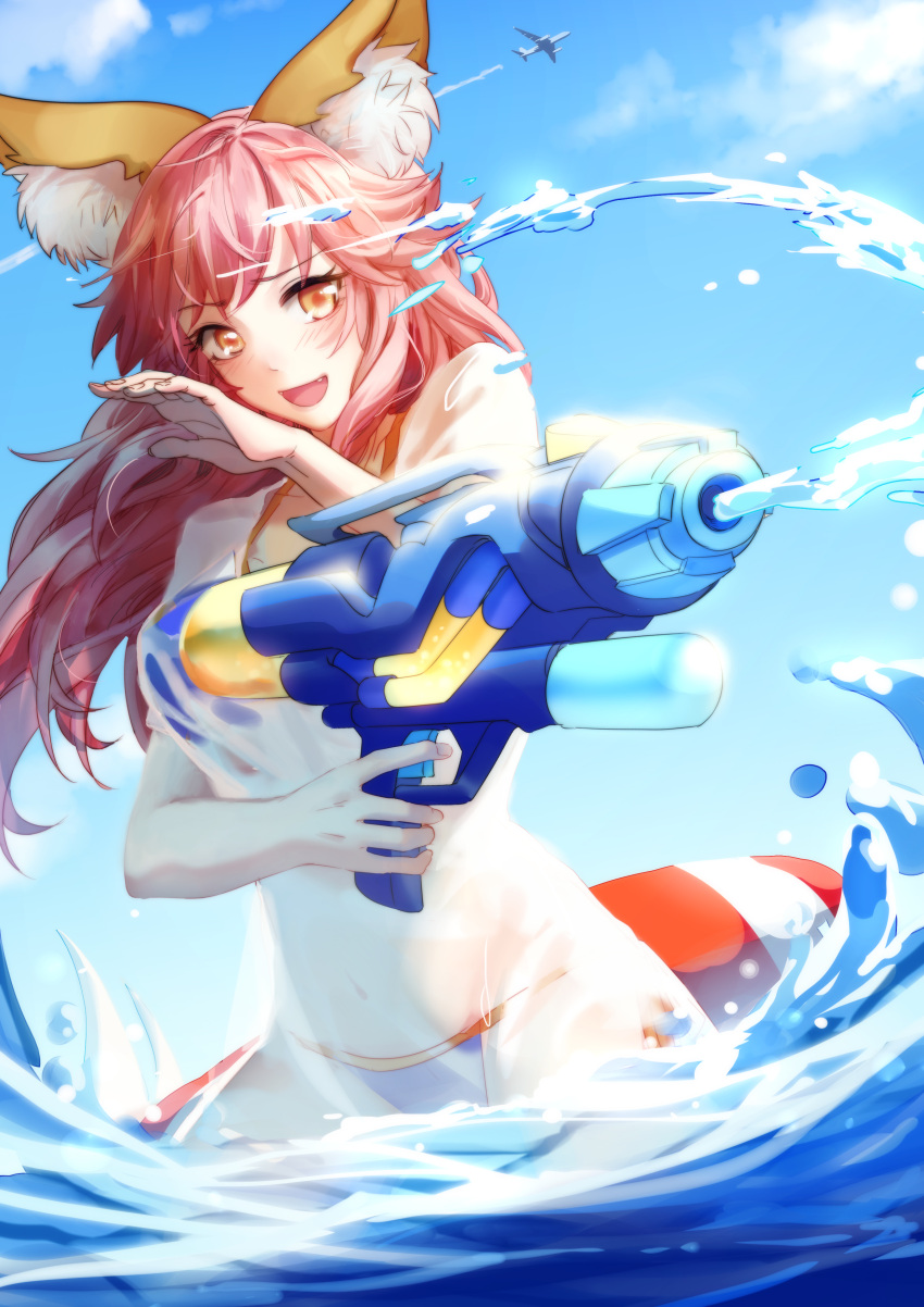 1girl absurdres aircraft airplane animal_ear_fluff animal_ears beach bikini bikini_under_clothes blue_bikini breasts clouds day fangs fate/grand_order fate_(series) flying fox_ears gun highres holding holding_gun holding_weapon innertube large_breasts looking_at_viewer ocean open_mouth outdoors pink_hair shirt side-tie_bikini sky solo swimsuit tamamo_(fate)_(all) tamamo_no_mae_(swimsuit_lancer)_(fate) water water_gun weapon wet wet_clothes wet_shirt wet_t-shirt yellow_eyes
