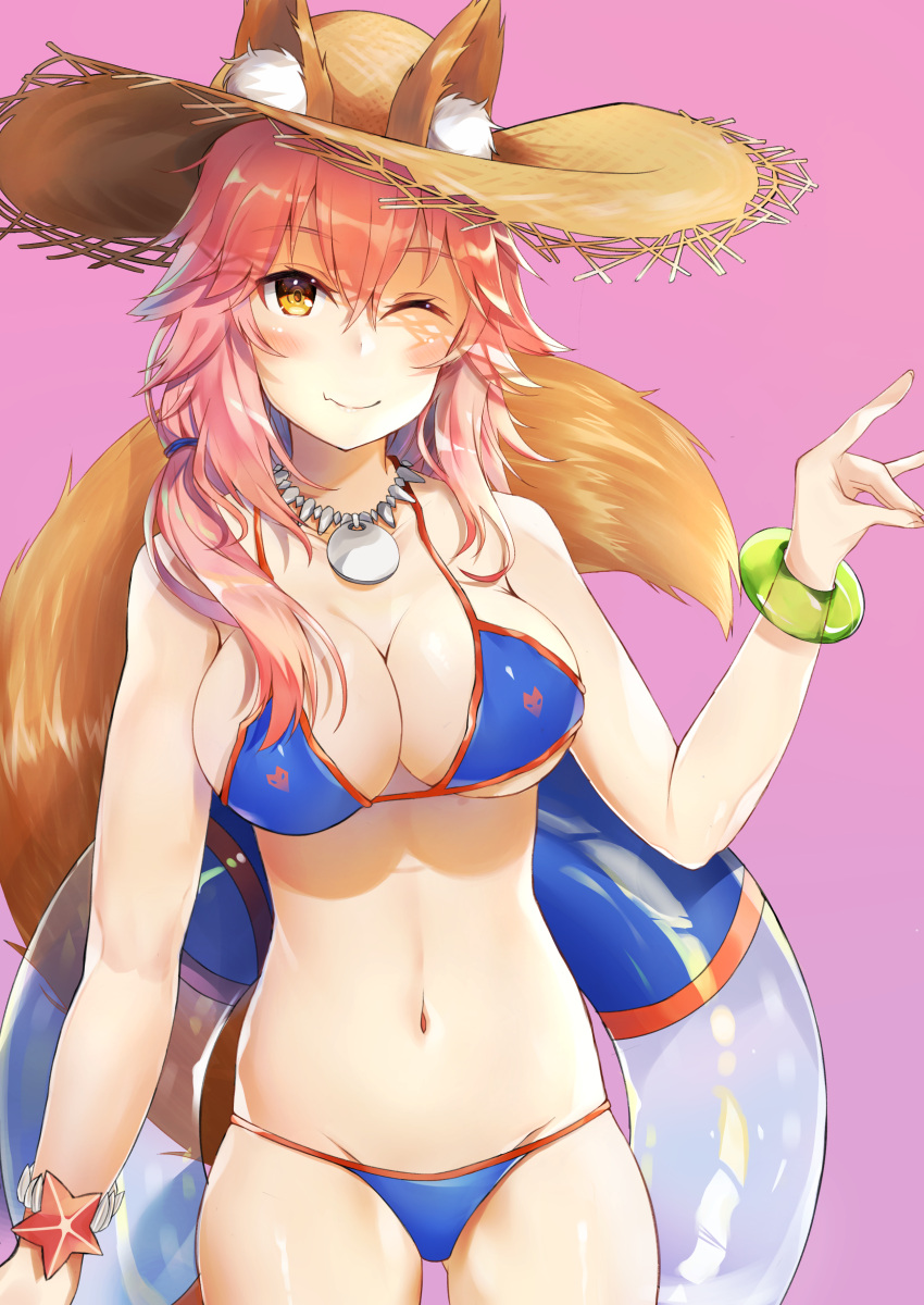 1girl absurdres animal_ear_fluff animal_ears atora bikini blue_bikini breasts cleavage closed_mouth collarbone ears_through_headwear fang fate/grand_order fate_(series) fox_ears fox_shadow_puppet fox_tail groin hat highres innertube large_breasts looking_at_viewer navel one_eye_closed paws pink_background pink_hair side-tie_bikini simple_background solo straw_hat swimsuit tail tamamo_(fate)_(all) tamamo_no_mae_(swimsuit_lancer)_(fate) yellow_eyes