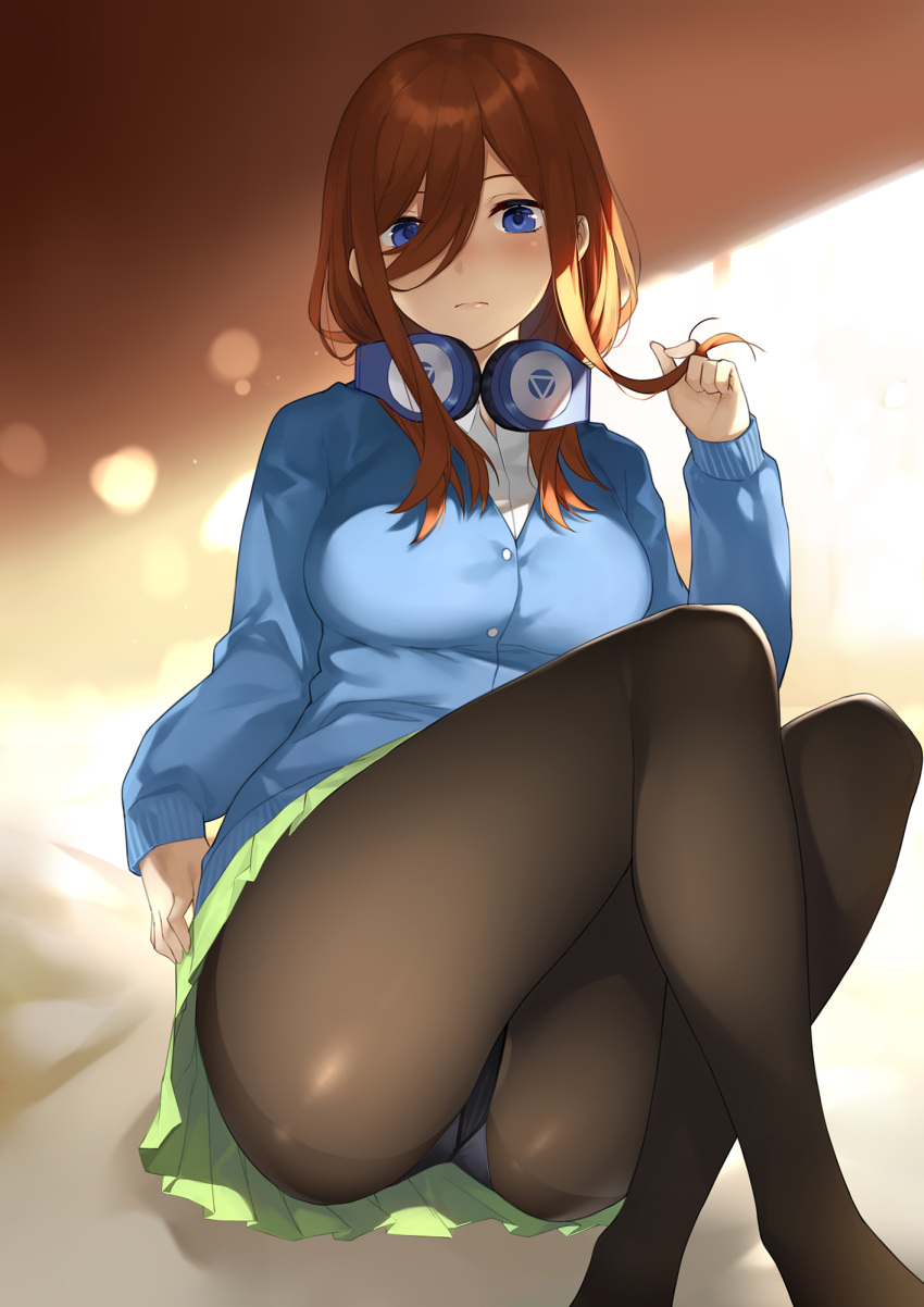 1girl ass black_legwear blue_eyes blue_sweater breasts brown_hair closed_mouth collared_shirt commentary_request expressionless eyebrows_visible_through_hair feet_out_of_frame go-toubun_no_hanayome green_skirt hair_between_eyes hair_twirling hand_up headphones headphones_around_neck highres knees_up legs_crossed long_hair looking_at_viewer medium_breasts nakano_miku panties panties_under_pantyhose pantyhose pleated_skirt see-through shirt sitting skirt sleeves_past_wrists solo sweater underwear white_shirt yykuaixian