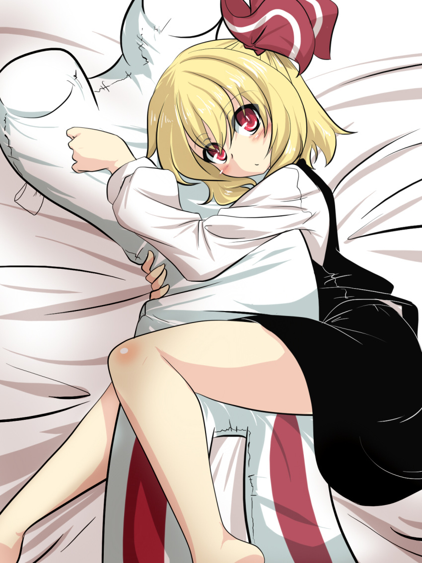 1girl artist_self-insert bare_legs barefoot blonde_hair blush body_pillow character_doll commentary_request full_body goma_(gomasamune) hair_between_eyes hair_ribbon highres long_hair looking_at_viewer lying on_bed on_side pillow pillow_hug rabbit red_eyes ribbon rumia skirt solo touhou vest