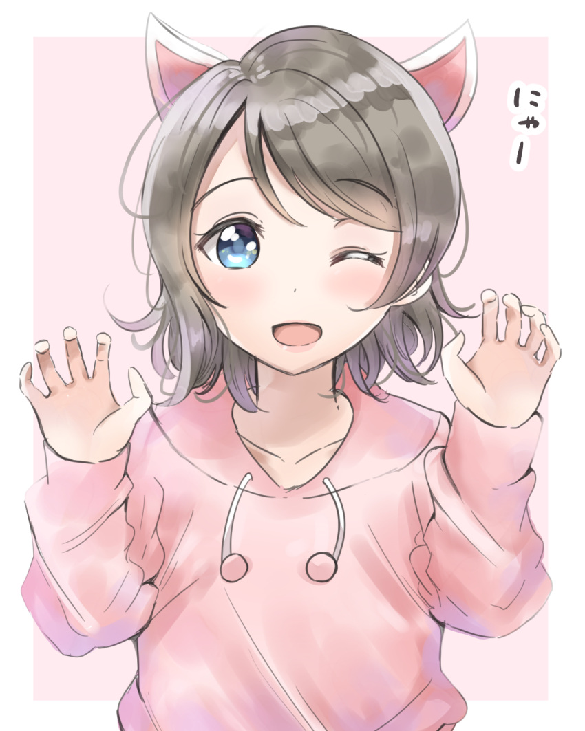 1girl ;d animal_ears blue_eyes cat_ears claw_pose commentary_request drawstring eyebrows_visible_through_hair grey_hair highres hood hood_down kemonomimi_mode long_sleeves looking_at_viewer love_live! love_live!_sunshine!! nyan one_eye_closed open_mouth pink pink_background pink_hoodie short_hair sin_(sin52y) smile solo upper_body watanabe_you