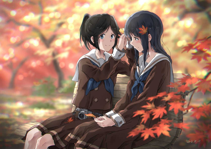 2girls autumn autumn_leaves bangs bench black_hair blue_eyes blue_neckwear blurry blurry_background brown_eyes brown_shirt brown_skirt camera closed_mouth commentary_request dappled_sunlight dated depth_of_field eyebrows_visible_through_hair feet_out_of_frame ginkgo_leaf hair_ornament hibike!_euphonium holding holding_leaf kasaki_nozomi leaf leaf_hair_ornament liz_to_aoi_tori long_hair long_sleeves looking_at_viewer medium_skirt multiple_girls neckerchief outdoors park park_bench parted_bangs sailor_collar shirt short_hair short_ponytail sidelocks signature skirt smile sunlight tree_bowbow white_sailor_collar yoroizuka_mizore yuri