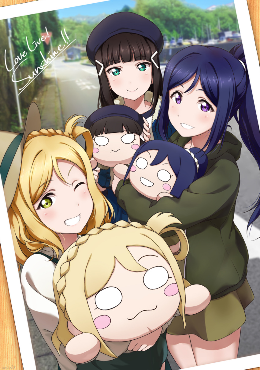 3girls :3 bangs beret black_hair blonde_hair blue_hair blue_hat blunt_bangs blush_stickers braid character_doll commentary_request copyright_name cowboy_hat crown_braid day eyebrows_visible_through_hair green_eyes green_skirt grin hair_ornament hair_rings hair_tie hairclip hat highres hood hood_down hoodie kurosawa_dia long_hair long_sleeves looking_at_viewer love_live! love_live!_sunshine!! matsuura_kanan medium_hair mole mole_under_mouth multiple_girls nesoberi ohara_mari one_eye_closed outdoors photo_(object) ponytail road shiimai skirt smile street tree violet_eyes