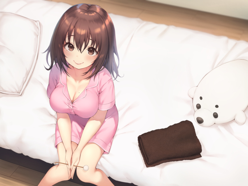 1girl bangs bed blush breasts brown_eyes brown_hair buttons cleavage closed_mouth collarbone eyebrows_visible_through_hair hair_between_eyes indoors large_breasts lips looking_at_viewer mimikaki mole mole_on_breast on_bed original pillow pink_pajamas pokachu short_sleeves sitting smile solo stuffed_animal stuffed_seal stuffed_toy towel wooden_floor