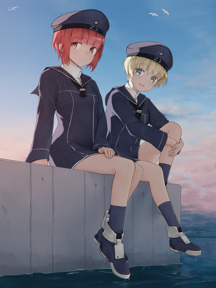 2girls absurdres bird blonde_hair blue_eyes blush brown_eyes closed_mouth clothes_writing clouds dress fancyark hat highres huge_filesize kantai_collection legs looking_at_viewer multiple_girls ocean open_mouth outdoors redhead sailor_collar sailor_dress sailor_hat seagull shoes short_hair sitting sky smile socks water z1_leberecht_maass_(kantai_collection) z3_max_schultz_(kantai_collection)