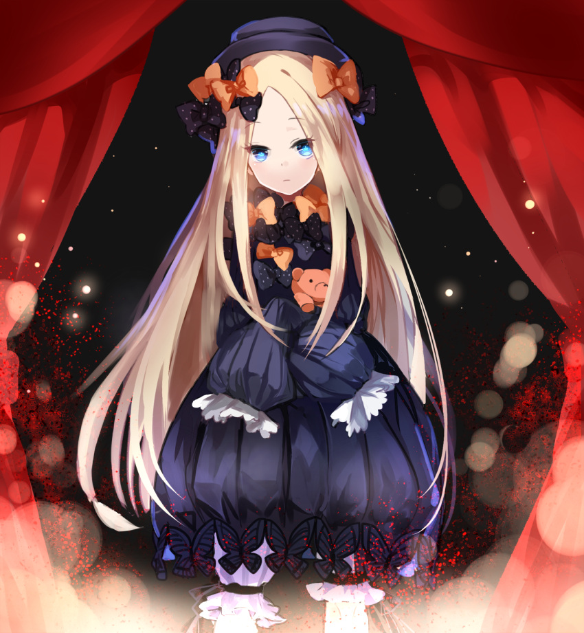 1girl abigail_williams_(fate/grand_order) bangs black_bow black_dress black_hat blonde_hair bloomers blue_eyes bow closed_mouth commentary_request dress fate/grand_order fate_(series) hair_bow hat highres holding holding_stuffed_animal light_particles long_hair looking_at_viewer object_hug orange_bow parted_bangs pekerika polka_dot polka_dot_bow purple_bow sleeves_past_fingers sleeves_past_wrists solo stage_curtains stuffed_animal stuffed_toy teddy_bear underwear very_long_hair white_bloomers