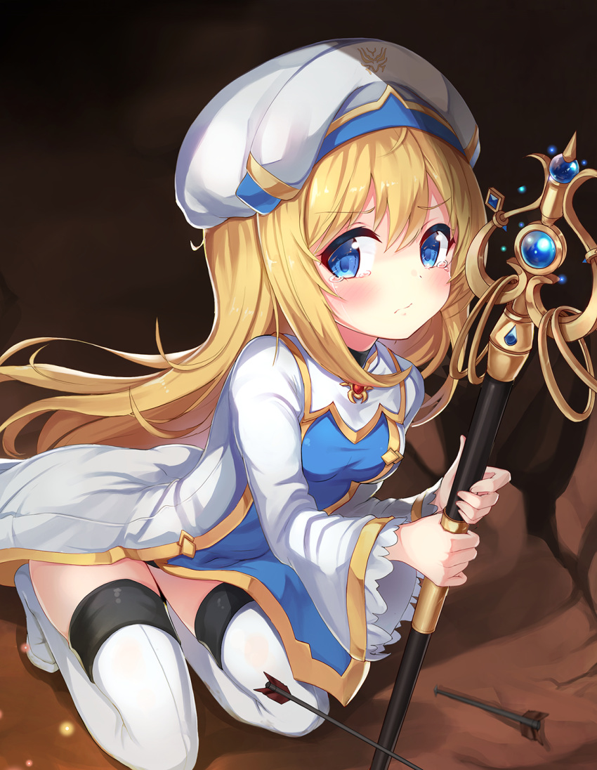 1girl 2drr arrow blonde_hair blue_eyes blush breasts cave cleric dress full_body goblin_slayer! half-closed_eyes hat highres kneeling long_hair looking_at_viewer priestess_(goblin_slayer!) sad small_breasts solo tearing_up tears thigh-highs very_long_hair wide_sleeves zettai_ryouiki