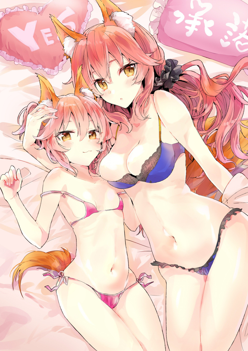 2girls :3 :o absurdres animal_ear_fluff animal_ears bangs bed_sheet black_scrunchie blush breasts brown_eyes brown_hair chestnut_mouth cleavage closed_mouth collarbone eyebrows_behind_hair fate/extra fate_(series) fingernails fox_ears fox_girl fox_tail frilled_pillow frills hair_between_eyes hair_ornament hair_scrunchie hand_up heart heart_pillow highres large_breasts long_hair looking_at_viewer lying multiple_girls navel on_back on_side panties pillow pink_panties purple_panties scarf scrunchie side-tie_panties small_breasts smile tail tamamo_(fate)_(all) tamamo_no_mae_(fate) tomozero underwear underwear_only very_long_hair yes-no_pillow